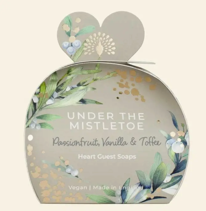 Christmas tidings under the mistletoe heart guest